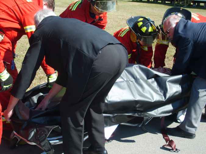 The fatality is placed in a body bag